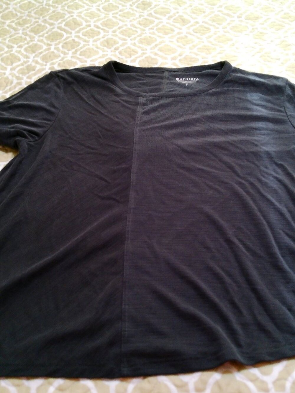 ATHELETA TOP CHARCOAL GRAY TOP IS AT ANGLE AT BOTTOM SIZE SMALL